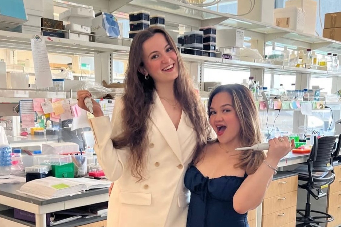 Two students smiling in the lab